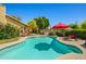 Beautiful backyard pool and spa area with mature landscaping and a covered patio at 10837 W Cottonwood Ln, Avondale, AZ 85392