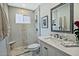Stylish bathroom featuring a walk-in shower, modern vanity, and chic tile design at 10939 N 111Th St, Scottsdale, AZ 85259