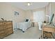 Cozy bedroom with a twin bed, bright window, and desk area, perfect for a or guest at 10939 N 111Th St, Scottsdale, AZ 85259
