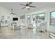 Bright dining area features a large window, ceiling fan and neutral decor and tile flooring at 10939 N 111Th St, Scottsdale, AZ 85259
