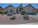 Charming single-story home featuring a well-maintained yard with desert landscaping and a red tile roof at 10939 N 111Th St, Scottsdale, AZ 85259