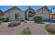 Charming home exterior featuring well-maintained landscaping and a two-car garage at 10939 N 111Th St, Scottsdale, AZ 85259