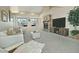 Inviting living room with vaulted ceiling, fireplace, and view of the outside at 10939 N 111Th St, Scottsdale, AZ 85259