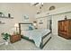 Spacious main bedroom with neutral tones, vaulted ceilings, and ample natural light from the windows at 10939 N 111Th St, Scottsdale, AZ 85259