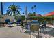 Relax on the patio with comfortable seating and a table, perfect for outdoor dining and entertaining at 10939 N 111Th St, Scottsdale, AZ 85259