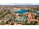 Breathtaking aerial view of a lakeside community featuring tennis courts and a tranquil lagoon at 1110 N Gull Haven Ct, Gilbert, AZ 85234