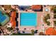 Aerial shot showcasing a pristine blue lap pool with neatly arranged lounge chairs and surrounding greenery at 1110 N Gull Haven Ct, Gilbert, AZ 85234