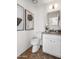 Well-lit bathroom with a granite vanity, framed art, and a modern toilet at 1110 N Gull Haven Ct, Gilbert, AZ 85234