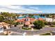 A picturesque clubhouse overlooking the lake, framed by palm trees and blue skies, perfect for leisure and events at 1110 N Gull Haven Ct, Gilbert, AZ 85234