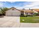 Charming single-story home featuring a three-car garage, a well-maintained lawn, and a classic Southwestern design at 1110 N Gull Haven Ct, Gilbert, AZ 85234