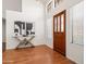 Bright, inviting foyer featuring hardwood floors, modern decor, and an elegant front door at 1110 N Gull Haven Ct, Gilbert, AZ 85234