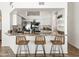 Entertainer's kitchen with granite countertop bar and stool seating overlooking the kitchen and breakfast area at 1110 N Gull Haven Ct, Gilbert, AZ 85234