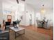 Open-concept living space with high ceilings, wood floors, and neutral decor flowing into dining area at 1110 N Gull Haven Ct, Gilbert, AZ 85234