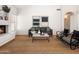 Inviting living room featuring a cozy fireplace, comfortable seating, and stylish decor on jute rug at 1110 N Gull Haven Ct, Gilbert, AZ 85234