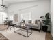 Bright living area with a vaulted ceiling, comfortable sofa, and natural light through windows at 1110 N Gull Haven Ct, Gilbert, AZ 85234