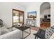 Comfortable living room with sliding glass doors to the backyard and a decorative TV console at 1110 N Gull Haven Ct, Gilbert, AZ 85234