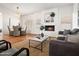 Open living space featuring a fireplace, dining table, and comfortable seating with an inviting atmosphere at 1110 N Gull Haven Ct, Gilbert, AZ 85234