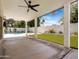 A covered patio provides shade and views of the backyard, enhancing the outdoor living experience at 1110 N Gull Haven Ct, Gilbert, AZ 85234