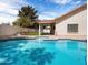 Inviting backyard pool with clear blue water, surrounded by a well-maintained patio and landscaping at 1110 N Gull Haven Ct, Gilbert, AZ 85234