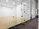 Racquetball court featuring glass wall and a door leading to a hallway for a modern and spacious design at 1110 N Gull Haven Ct, Gilbert, AZ 85234