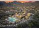 Aerial view of community pool and recreation center showcasing mountain views and desert landscaping at 11339 E Beck Ln, Scottsdale, AZ 85255