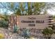 Elegant community sign showcasing the neighborhood's name surrounded by desert plants at 11339 E Beck Ln, Scottsdale, AZ 85255