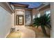 Stylish entryway with stone pathway, desert landscaping, and unique front door design at 11339 E Beck Ln, Scottsdale, AZ 85255