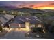 Elegant home boasts stunning architecture with a tile roof and professional landscaping, set against a mountain backdrop at 11339 E Beck Ln, Scottsdale, AZ 85255