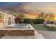 Backyard features a hot tub with beautiful desert landscaping and scenic sunset views, perfect for relaxation and entertaining at 11339 E Beck Ln, Scottsdale, AZ 85255