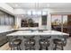 Modern kitchen with a large island, stainless steel appliances, and sleek cabinetry at 11339 E Beck Ln, Scottsdale, AZ 85255