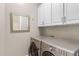 Convenient laundry room with stainless-steel washer and dryer set at 11339 E Beck Ln, Scottsdale, AZ 85255