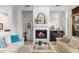 Comfortable living room with fireplace, stylish decor, and plenty of natural light at 11339 E Beck Ln, Scottsdale, AZ 85255