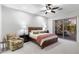 Spacious main bedroom features a comfortable seating area and sliding glass doors to a private patio at 11339 E Beck Ln, Scottsdale, AZ 85255
