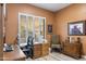 Comfortable office with a large desk, shuttered windows, and natural light at 11339 E Beck Ln, Scottsdale, AZ 85255
