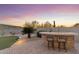Outdoor bar with stone accents complements the desert landscape, ideal for entertaining guests at 11339 E Beck Ln, Scottsdale, AZ 85255