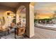 Inviting outdoor living space featuring multiple seating areas and lush landscaping with a hot tub and desert views at 11339 E Beck Ln, Scottsdale, AZ 85255