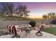 Inviting outdoor patio features a cozy fire pit and comfortable seating, perfect for relaxing evenings at 11339 E Beck Ln, Scottsdale, AZ 85255