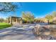 Open picnic area with new looking tables, bench, desert landscaping and a concrete walking path at 11339 E Beck Ln, Scottsdale, AZ 85255