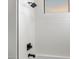 Modern bathroom featuring tiled walls, showerhead, and window at 11339 E Beck Ln, Scottsdale, AZ 85255