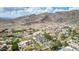 Panoramic aerial shot showcasing a luxurious home with a pool and tennis court at 11827 S Montezuma Ct, Phoenix, AZ 85044