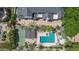 Top-down view of a home with a pool, spa, and tennis court surrounded by desert landscaping at 11827 S Montezuma Ct, Phoenix, AZ 85044