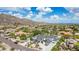 Luxury desert home featuring lush landscaping, a porte-cochere, and breathtaking mountain views at 11827 S Montezuma Ct, Phoenix, AZ 85044