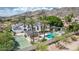 Backyard oasis with pool, tennis court, and covered patio, perfect for outdoor entertaining at 11827 S Montezuma Ct, Phoenix, AZ 85044