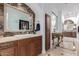 Bathroom vanity featuring marble countertop and stylish mirror at 11827 S Montezuma Ct, Phoenix, AZ 85044
