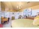 Bright bedroom features yellow ceiling, playful art, and connects to ensuite bathroom, perfect for a retreat at 11827 S Montezuma Ct, Phoenix, AZ 85044