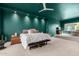 Spacious primary bedroom suite featuring accent wall and step-up platform seating area at 11827 S Montezuma Ct, Phoenix, AZ 85044