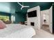 Bedroom with stunning stone fireplace and access to other areas of the house at 11827 S Montezuma Ct, Phoenix, AZ 85044
