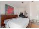Modern bedroom with neutral tones, a platform bed, and minimalist decor at 11827 S Montezuma Ct, Phoenix, AZ 85044
