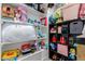 Neatly organized closet space with shelves, providing ample storage for toys and accessories at 11827 S Montezuma Ct, Phoenix, AZ 85044