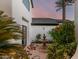 Picturesque courtyard with a charming fountain, lush greenery, and elegant architectural details creating a tranquil outdoor space at 11827 S Montezuma Ct, Phoenix, AZ 85044